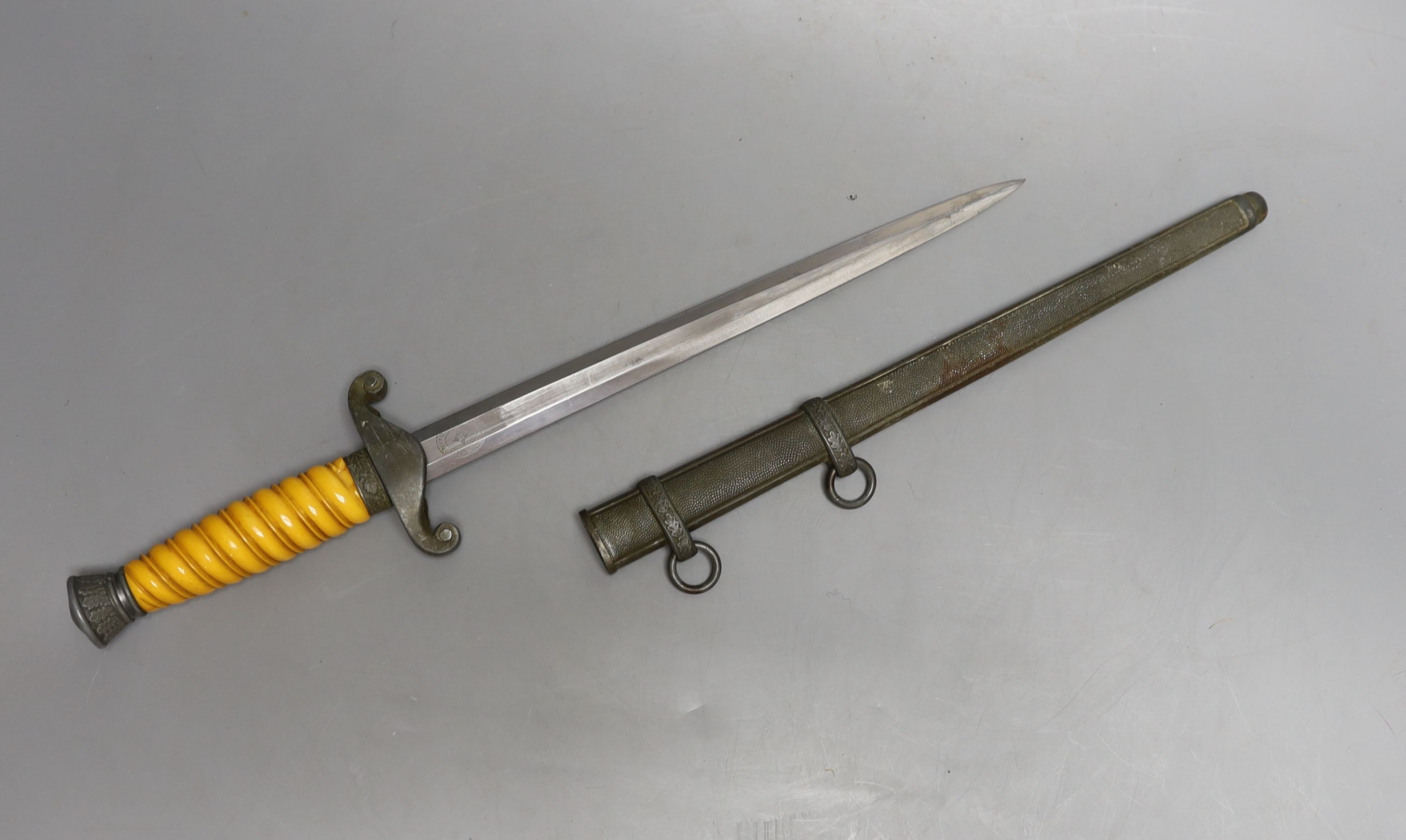 A WWII Third Reich army officer's dress dagger (chip to handle), 40 cms long.